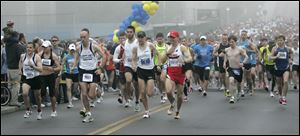 Matt Folk, No. 1 near center, and rivals start at the UT campus under gray skies. Sunday's cool weather made a difference; last year, the temperatures were in the 80s. The race ended in the Glass Bowl. 
<BR>
<img src=http://www.toledoblade.com/graphics/icons/photo.gif> <font color=red><b>PHOTO GALLERY</b></font>: <a href=