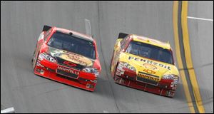 Kevin Harvick, right, drops low to pass
Jamie McMurrayon the final lap
 to win the Aaron's 499 Sunday at Talladega. There were a record 88 lead changes among 29 drivers.