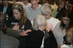 CTY nevaeh 26p   04/026/2010       The Blade/Lori King  Sherry Buchanan, center, grandmother of Nevaeh Buchanan, weeps during prayer service held at Nevaeh Buchanan Reward Poster Campaign at the Moose Lodge in Monroe, Mich.