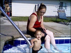 Family members say Dominic Moran, with his mom, Crystle Encalado, was a happy child who just turned 2 last month.