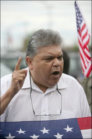 Former Toledo City Councilman Louis Escobar compared Arizona's immigration law with policies of Nazi Germany. 