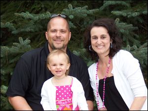 Carrie Samples has been cancer-free for more than a year and she and her husband, Josh, are enjoying their daughter, Mia.
