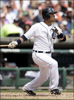 Detroit's Ramon Santiago watches his two-run home run hit off Boston starter John Lackey in the fourth inning. Santiago helped the Tigers win their fourth straight home series against reigning playoff teams, a feat no team has accomplished in the wild card era, which began in 1995.