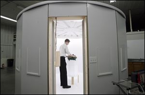 Jeff Nissen places tortoises in a TechTol Imaging studio that produced three-dimensional images of the reptiles within seconds. The company plans educational and security uses for its technology. 