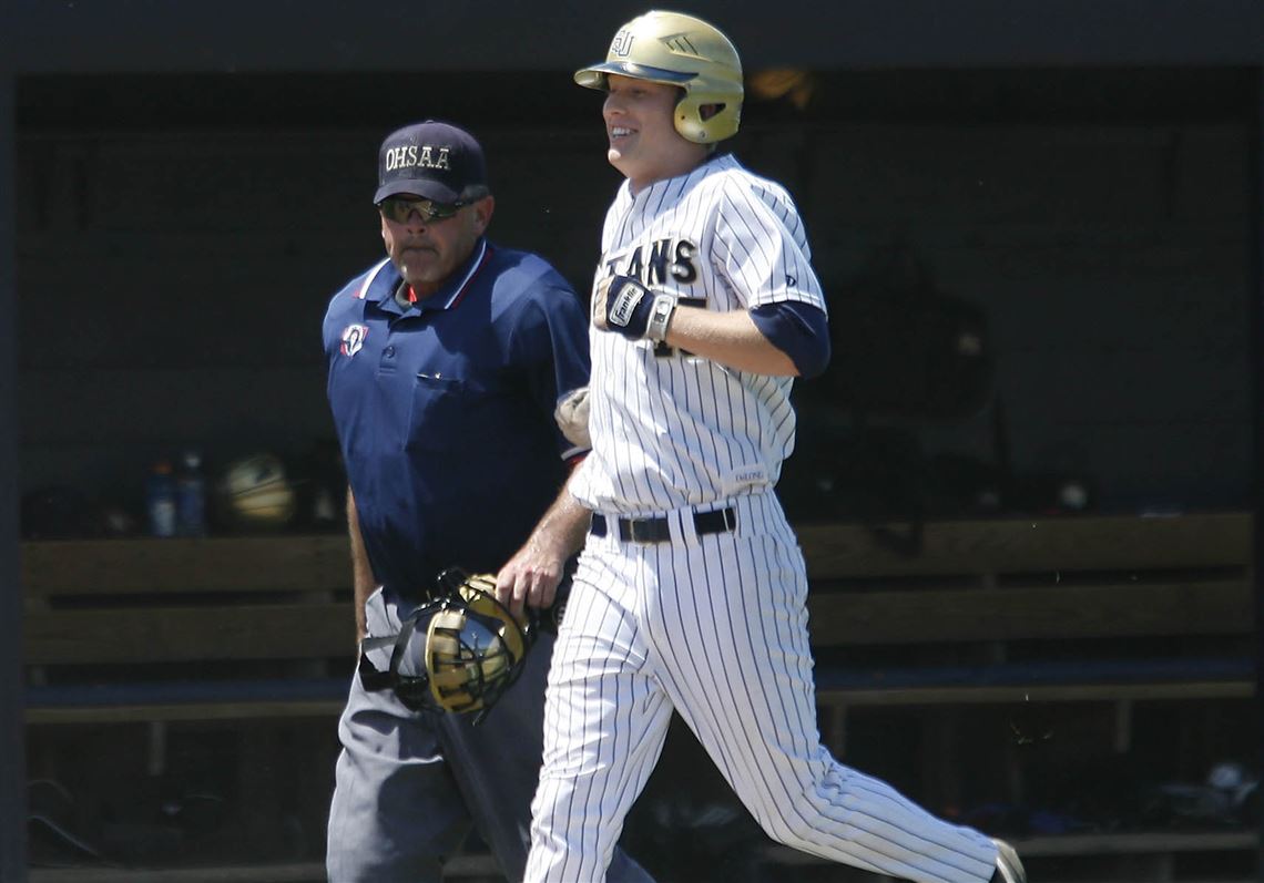 St. John's senior shortstop Jake Ray prepares to touch the plate after clubbing a two-run home run in the sixth inning of a City League semifinal yesterday against Whitmer. Ray is hitting .534 on the season and has belted six home runs and driven in 37 runs for the Titans.