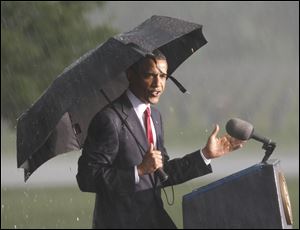 President Obama begins his Memorial Day remarks at the Abraham Lincoln National Cemetery in Elwood, Ill., before a fierce rainstorm canceled yesterday's observance.