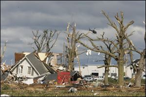 A helicopter surveys the damage across Lake Township.