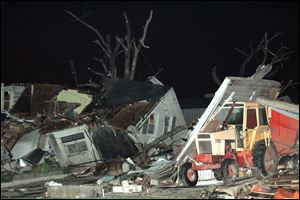 Damaged structures and stripped trees on the north side of 795 west of Lake HIgh School.<br>
(THE BLADE/JETTA FRASER)
