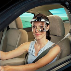 A head-mounted sensor array monitors eye movement and fatigue during an experiement at Ford.