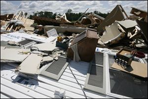 Sierra and two other people took cover in a first-floor bathroom as two floors of the three-story house caved in on them. Their only protection was a cabinet built by a family member.