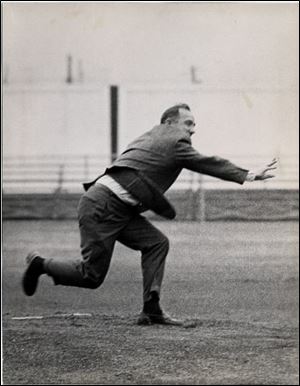 Congressman Ashley throws the first pitch at a 1965 Mud Hens game.