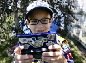Boy Scout Robbie Nicely earned a video game belt loop a few months ago and is working on his academic pin next.