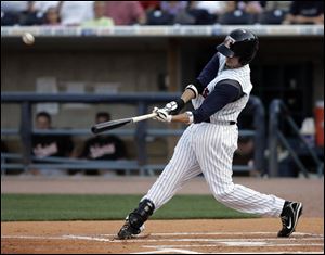 Toledo's Jeff Larish hits a three-run homer in the first inning against Norfolk.