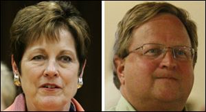 Francine Lawrence, left, president of the teachers union and Toledo school Superintendent John Foley, right.