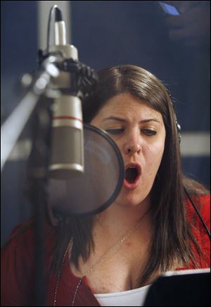 Rachel Beranek of Toledo sings a part in the song. The group plans to unveil the song Saturday at LZ Michigan, a conference to honor Vietnam War veterans, in Grand Rapids, Mich.