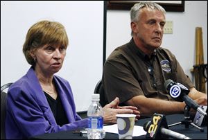 Anne Baker, left, executive director of the Toledo Zoo, and elephant expert Alan Roocroft discuss the incident Thursday in which an elephant injured a zoo worker.