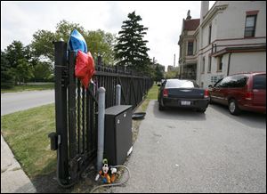 Authorities say Ahjzanae Triplett, 11, was caught between the mechanical gate and the control box at the Museum Place apartments. It was unclear why the gate opened or how the girl got stuck. 