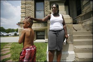 Alesia Abbott, with son Tobin Triplett II, 4, talks about her 11-year-old daughter's death.