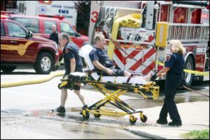 A firefighter is taken to the hospital after sustaining a minor injury battling the blaze.