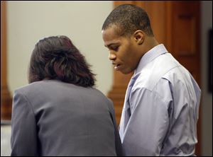 Aaron Jones, 21, of Church Street in Toledo, confers with his attorney, Nicole Khoury, during his trial in Common Pleas Court. Patterson