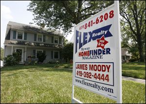 A buyer is sought for a home in the 2300 block of Middlesex Drive. Realtors say the market appears headed in the right direction.