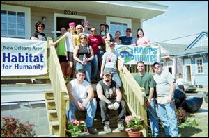 The Lourdes College Habitat for Humanity Alternative Spring Break team in front of the house they worked on in New Orleans after Hurricane Katrina.
