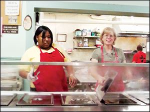 Helping Hands: Lourdes students serve meals to those at Helping Hands of St. Louis.
