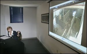 Anne Baker, executive director of the Toledo Zoo, narrates as the video of Louie the elephant attacking trainer Don RedFox during a news conference at the zoo. 