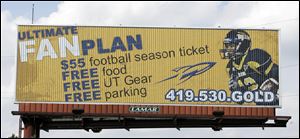 Springfield graduate Eric Page is featured on billboards promoting Toledo season tickets. Last season, he led all freshmen nationally with 82 catches and 1,159 receiving yards. He is one of 11 area players on UT's roster. 