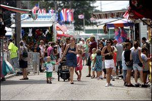 The midway appeared to be crowded in some areas during Wednesday's free day. 