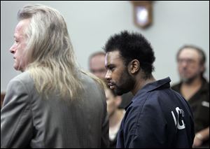 Adrian Cimerman entered a not-guilty plea for Lawrence Fitzgerald James, right, in the slaying of UT student Casey Bucher.