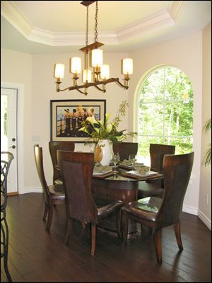 A palladian window offers views of the backyard to dinner guests.