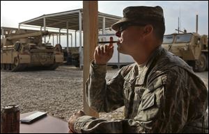 Staff Sgt. Lucas C. Trammell took part in the invasion of Iraq in 2003.  He is now on his fourth tour,  one of the 50,000 troops slated to remain in a noncombat role.
