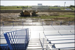 More than a foot of dirt and sod had to be removed from Lake High School's old field to make sure all debris from the June 5 tornado was gone before the synthetic turf could be installed.