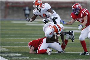Southview's Jalen Marable dives for yardage in Friday night's game against St. Francis at UT.
