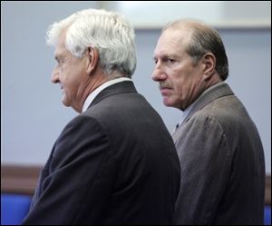 Attorney James Van Deilen, left, with his client, John Briggle, says Briggle is 'an honest guy that did some things, really stupid things.' Briggle apologized in court yesterday for his actions, saying he regretted his involvement.