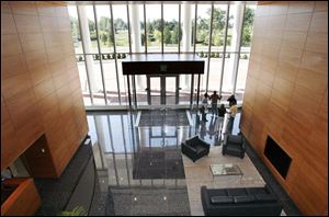 The grand staircase is gone, and granite and wood are featured in the two-story lobby to help the 95 employees take in the ambiance, officials said. 