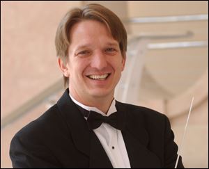 Resident conductor Jeffery Pollock conducts the Toledo Symphony Sept. 12 at Put-in-Bay.