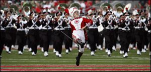 The Ohio State Marching Band takes the field in the Buckeyes' season opener in Columbus.