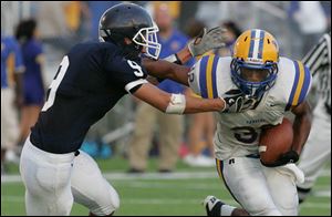 Northwood's Mike Prothero pushes away from Lake's DylanHirzel in last night's game. The Rangers improved to 2-0.
