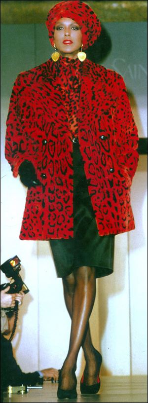 Billie Blair models Yves St. Laurent fashion during a 1980s runway show.
