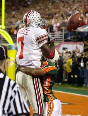 Miami's Glenn Sharpe is called for a penalty against OSU's Chris Gamble on a play in overtime in the 2002 title game.