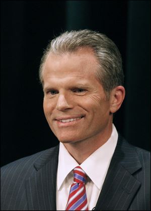 Michigan attorney General Mike Cox seeks a preliminary injunction while a lawsuit against the Corps of Engineers proceeds.