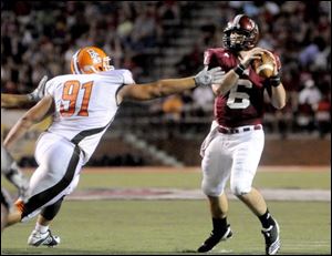 Bowling Green's Chris Jones (91) applies pressure to Troy University quarterback Corey Robinson during last Saturday's game at Troy. 