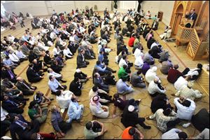 CTY EID10p   The Blade/Lori King  09/10/2010  Muslims listen to speaker Board of Trustees member Dr. Abed El. Manan Alo,who spoke after the prayer service to celebrate Eid ul-Fitr at the Masjid Saad in Sylvania, Ohio. Eid ul-Fitr is a holiday marking the end of the holy month of Ramadan.