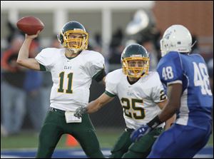 Clay quarterback Josh Utter looks to pass against Springfield as Kyle Steveson provides protection in the backfield. Utter completed 5 of 13 passes for 102 yards.