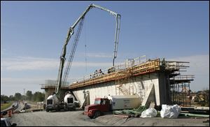 Mosser Construction crews work on a viaduct that will carry the new U.S. 24 over its westbound exit to Waterville. Good weather since Labor Day has helped keep the work in the fast lane. 