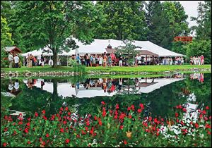 Guests dined and mingled under giant tents in the midst of this beautiful garden setting at the Schedel Arboretum & Gardens.

<img src=http://www.toledoblade.com/graphics/icons/photo.gif> <font color=red><b>PHOTO GALLERY:</b></font> ON THE TOWN: <a href=