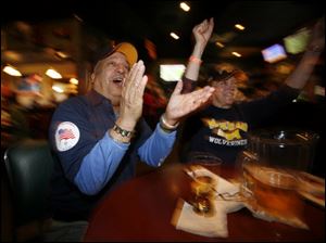 Izzy and Celia Ortiz enjoy Michigan's play at M.T. Loonies.