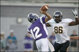 Kenny Hayes puts pressure on Fremont Ross quarterback Tyler Wolf. Hayes has 11 tackles with two for losses, one sack, and two pass knockdowns.